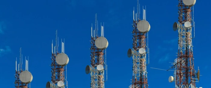 Telecommunication towers against the sky