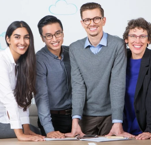 A team of valuation professionals reviewing a signed document together
