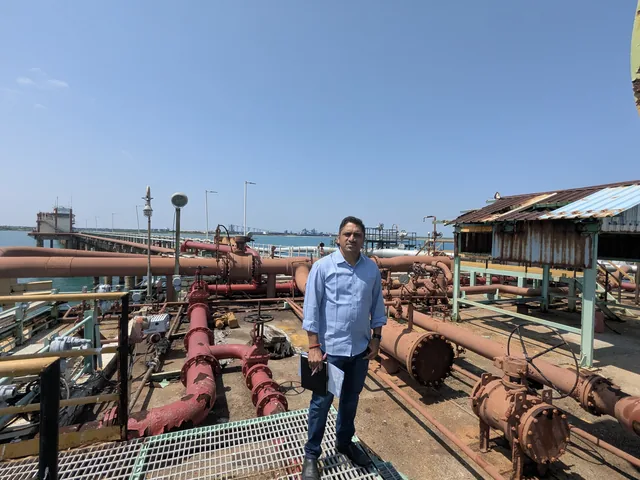 An Axium valuer inspecting pipeline infrastructure at a port jetty